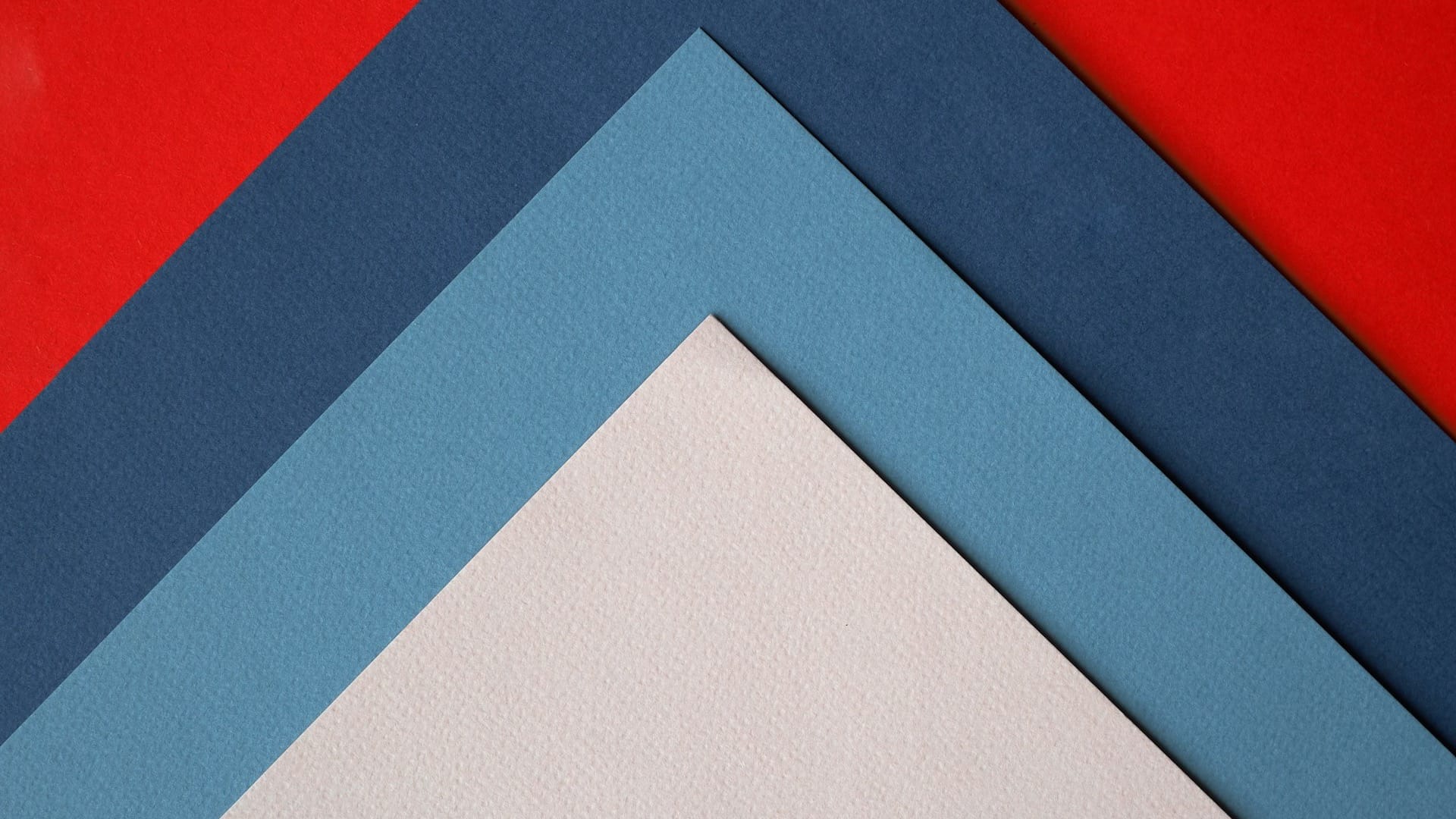 Sheets of colored paper layered in offset stacked layers