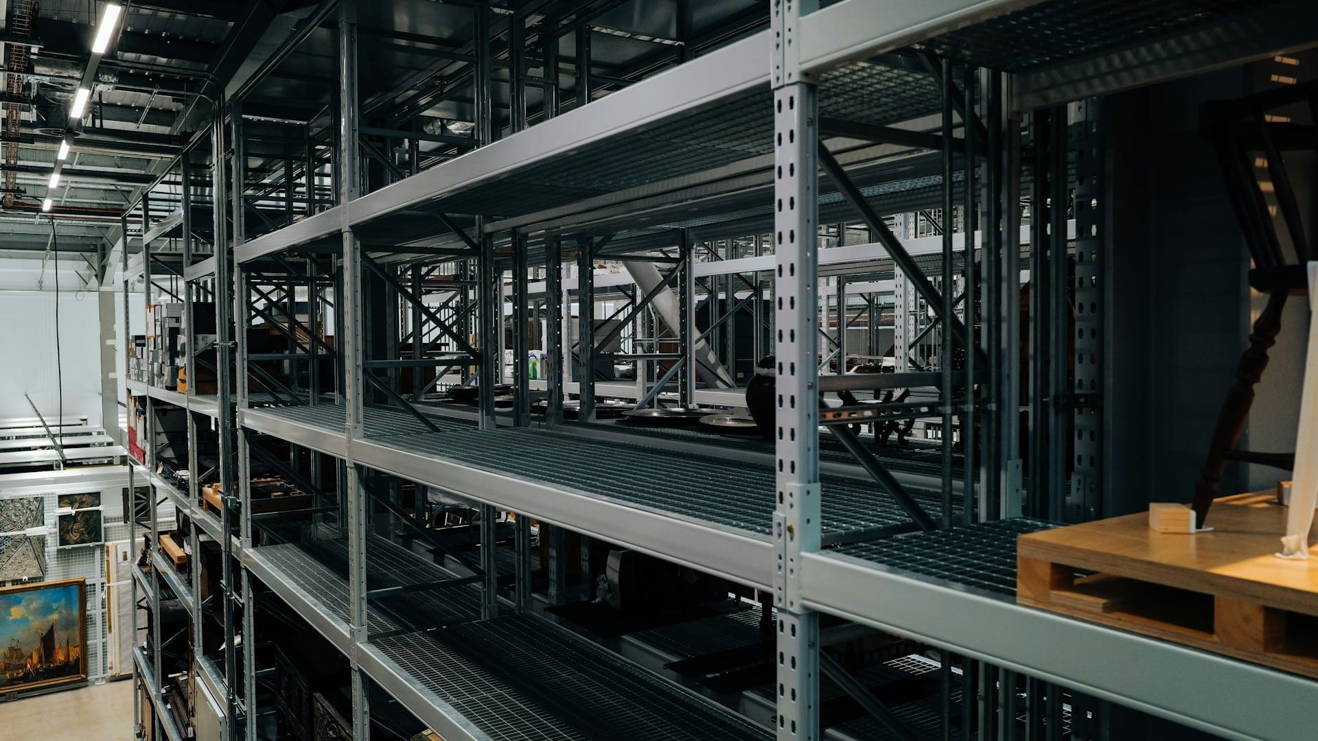 Tall industrial warehouse shelving holding stored goods