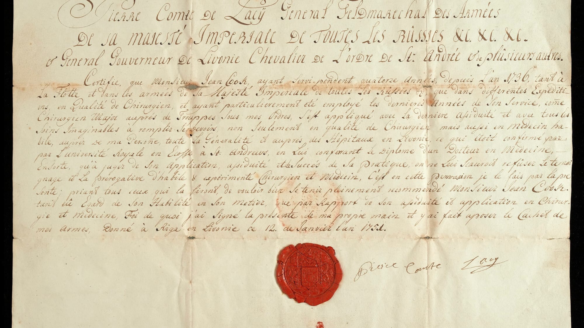 A handwritten manuscript certificate with a wax seal attached at its foot.