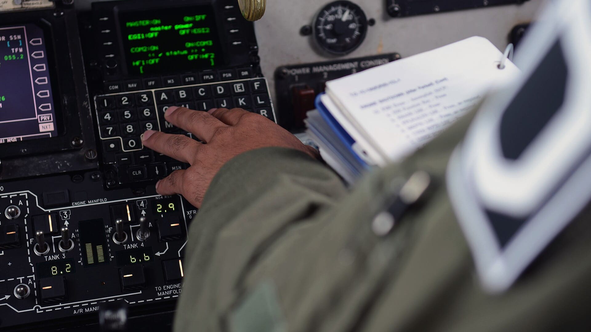 A pilot reading a preflight checklist in an aircraft cockpit before departure.